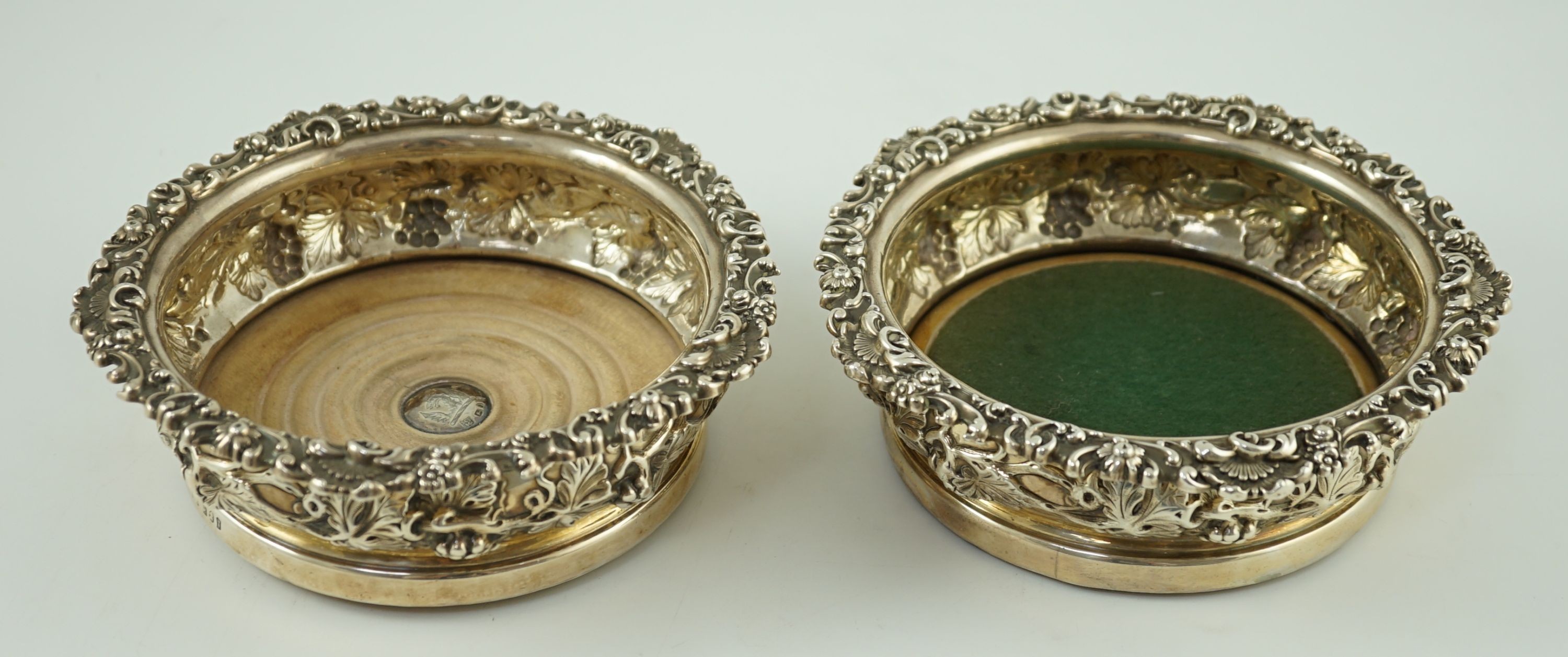 A pair of George IV silver mounted wine coasters, by S.C. Younge & Co